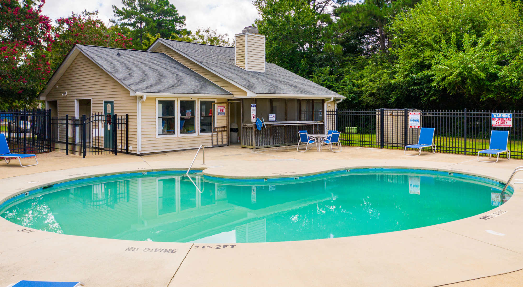 Swimming pool and clubhouse at Bryan Woods Apartments in Garner, North Carolina