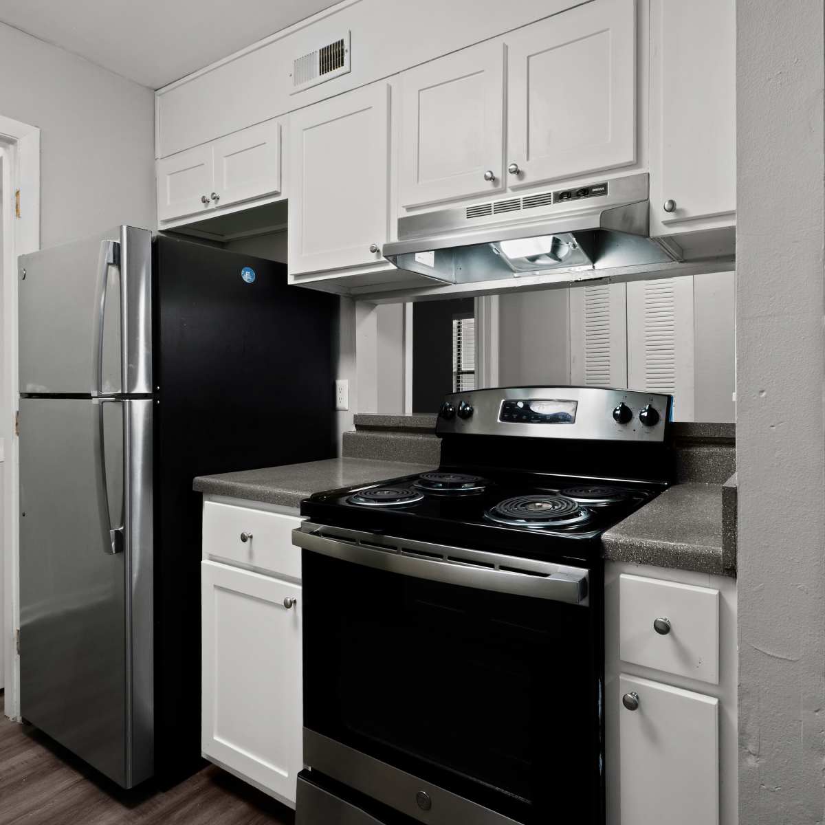 Updated kitchen with stainless-steel appliances at Bryan Woods